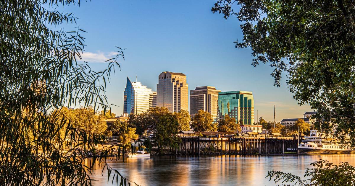 City skyline. Boat on water. Greenery. Sacramento is a great place for a date night.