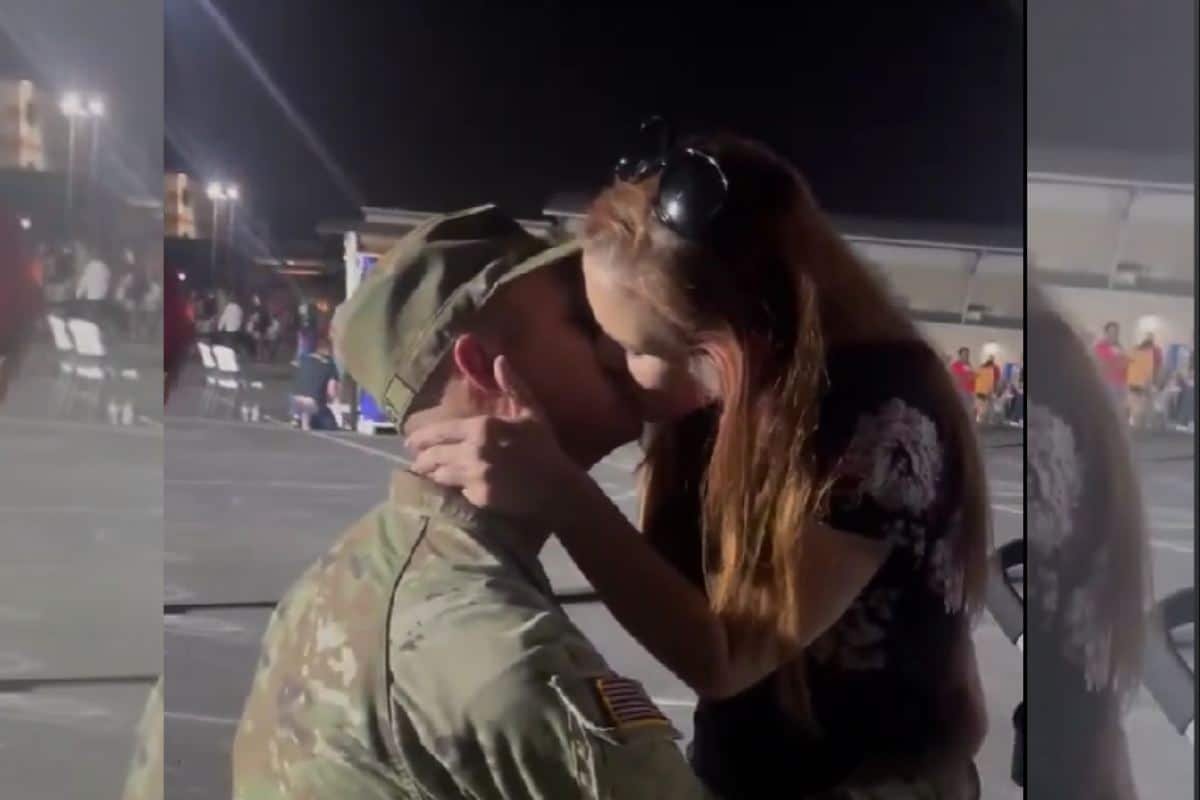 Adam and Amanda kissing joyfully after she said "yes!" to his marriage proposal.