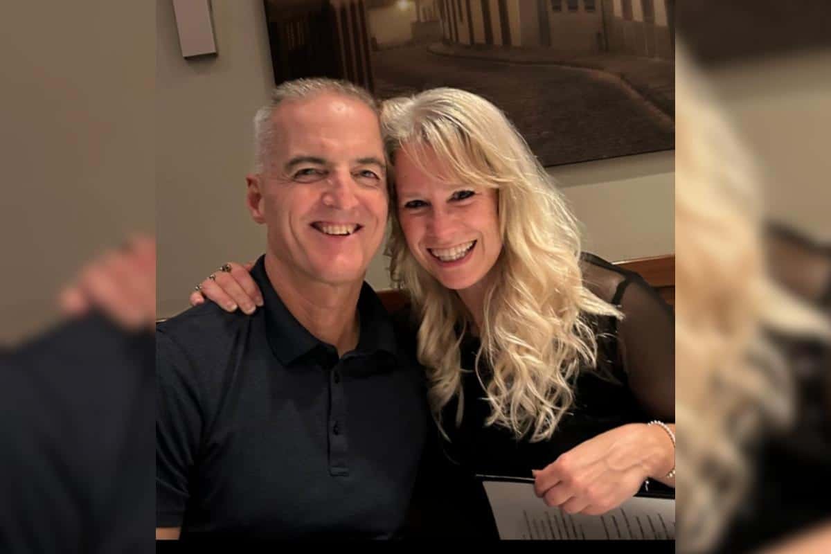 Bruce and Brenda smiling with arms around one another