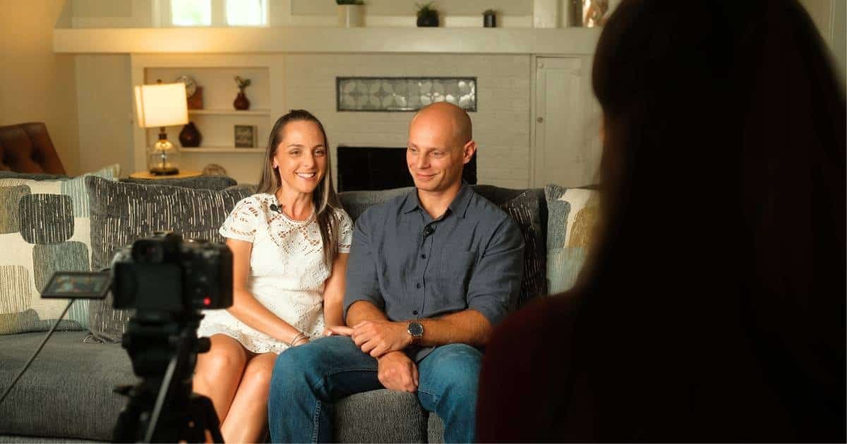 Aly, the post's author, interviewing a couple about their experience with State MatchMaking Company