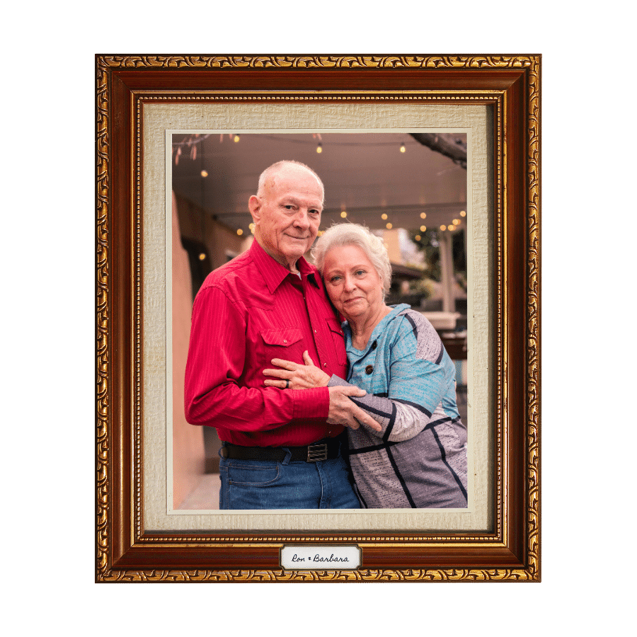 Elderly couple pose for the camera