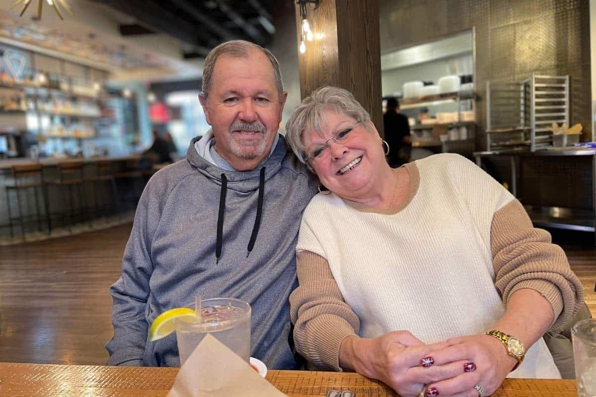 Joyful couple in their 60's who met through State MatchMaking Company out on a date at a restaurant